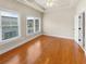 Bedroom with tray ceilings, hardwood floors, and large windows for natural light at 789 Liberty Commons Nw Dr, Atlanta, GA 30314
