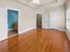 Large bedroom features hardwood floors, tray ceilings, and ensuite bathroom at 789 Liberty Commons Nw Dr, Atlanta, GA 30314