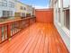 Exterior image of an orange wooden deck with painted railing and lattice at 789 Liberty Commons Nw Dr, Atlanta, GA 30314