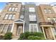 Charming townhome with a brick and stucco exterior and inviting front porch at 789 Liberty Commons Nw Dr, Atlanta, GA 30314