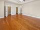 Main bedroom with hardwood floors, ceiling fan, and walk-in closets at 789 Liberty Commons Nw Dr, Atlanta, GA 30314