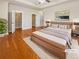Comfortable main bedroom with hardwood floors and a ceiling fan at 789 Liberty Commons Nw Dr, Atlanta, GA 30314