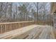 Large wooden deck overlooking a wooded backyard offers outdoor living space at 115 Bruce Rd, Douglasville, GA 30134