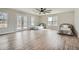 Spacious bedroom with natural light streaming through windows and French doors to a deck, plus wood-look flooring at 115 Bruce Rd, Douglasville, GA 30134