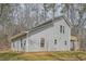 Exterior elevation of home shows vinyl siding, and a back deck area at 115 Bruce Rd, Douglasville, GA 30134