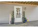 Charming front door with welcoming decor, potted plants, and a 'Welcome' sign at 115 Bruce Rd, Douglasville, GA 30134