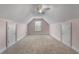 Large attic space with two doors and a window at 155 Rose Creek Dr, Covington, GA 30014