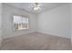 Bright bedroom with natural light from the window and neutral carpeting at 155 Rose Creek Dr, Covington, GA 30014