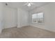 Neutral bedroom with natural light, carpeting, and a double closet at 155 Rose Creek Dr, Covington, GA 30014