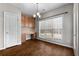 Sunlit breakfast nook features built-in desk, wood cabinets and large window views at 155 Rose Creek Dr, Covington, GA 30014