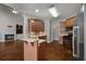 Kitchen with stainless appliances overlooks living room and fireplace, creating an inviting space at 155 Rose Creek Dr, Covington, GA 30014