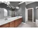 Bathroom featuring dual sinks, tile floors, a separate shower, and a tub at 155 Rose Creek Dr, Covington, GA 30014