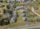 An aerial view of a home with a large yard surrounded by mature trees and nearby houses at 545 Highway 155 N, Mcdonough, GA 30253