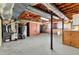 Unfinished basement with utilities and exposed ceiling at 545 Highway 155 N, Mcdonough, GA 30253