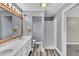 Well-lit bathroom showcasing a double sink vanity, shower, wood look floors, and neutral color palette at 545 Highway 155 N, Mcdonough, GA 30253