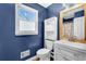 Bathroom with blue walls, modern vanity, and built-in storage at 545 Highway 155 N, Mcdonough, GA 30253