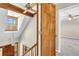 Hallway with skylight, wood door, and a lantern pendant for a bright and welcoming space at 545 Highway 155 N, Mcdonough, GA 30253