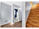 Hallway view with staircase and powder room at 545 Highway 155 N, Mcdonough, GA 30253