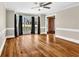 Bright living room featuring hardwood floors, large windows, and neutral paint at 545 Highway 155 N, Mcdonough, GA 30253