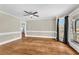 Bright living room featuring hardwood floors, large windows, and neutral paint at 545 Highway 155 N, Mcdonough, GA 30253