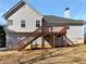 Back of the house features a wooden deck and stairs at 63 Avery Way, Dallas, GA 30157