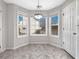 Charming breakfast nook with bay windows offering an abundance of natural light and a modern light fixture at 63 Avery Way, Dallas, GA 30157