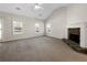 Spacious living room featuring a stone fireplace and large windows at 63 Avery Way, Dallas, GA 30157