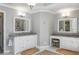 Elegant bathroom with double vanity sinks, granite countertops, and stylish fixtures at 9465 Mistwater Close, Roswell, GA 30076