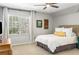 Bright bedroom with large window and neutral decor at 9465 Mistwater Close, Roswell, GA 30076