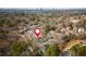 Aerial view of a complex surrounded by lush trees, showing proximity to the city at 1323 Weatherstone Ne Way, Atlanta, GA 30324