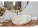 Close up on a bathroom sink with a stone bowl and gold faucet at 1323 Weatherstone Ne Way, Atlanta, GA 30324