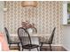 Stylish dining room featuring decorative wallpaper and a modern light fixture at 1323 Weatherstone Ne Way, Atlanta, GA 30324