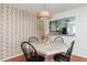 Dining room with view to adjacent kitchen, showcasing hardwood floors and contemporary decor at 1323 Weatherstone Ne Way, Atlanta, GA 30324