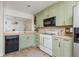 Bright kitchen with modern appliances and light-colored cabinets, creating a clean and inviting space at 1323 Weatherstone Ne Way, Atlanta, GA 30324