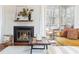 Close up of fireplace and stylish decor in the bright living room at 1323 Weatherstone Ne Way, Atlanta, GA 30324