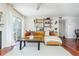 Bright living room with stylish decor, floating shelves, and a view to the balcony at 1323 Weatherstone Ne Way, Atlanta, GA 30324