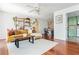 Open-concept living room seamlessly blends into the kitchen and dining area, hardwood floors at 1323 Weatherstone Ne Way, Atlanta, GA 30324