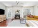 Bright living room showcases a fireplace, large windows, and stylish furniture at 1323 Weatherstone Ne Way, Atlanta, GA 30324