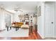 Spacious living room featuring hardwood floors, floating shelves, and sliding glass doors at 1323 Weatherstone Ne Way, Atlanta, GA 30324