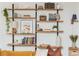 Stylish wall shelves displaying books and decor, accenting the living room, with natural light at 1323 Weatherstone Ne Way, Atlanta, GA 30324