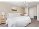 Calm main bedroom with neutral colors, plush bedding, and ample natural light at 1323 Weatherstone Ne Way, Atlanta, GA 30324