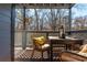 This cozy patio has a dark wooden floor, a patio table, and string lights at 1323 Weatherstone Ne Way, Atlanta, GA 30324