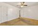 Bedroom featuring carpet, ceiling fan, and two doors, neutral palette at 162 Fairburn Sw Rd, Atlanta, GA 30331