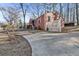 Brick home with a concrete driveway and fenced yard at 162 Fairburn Sw Rd, Atlanta, GA 30331