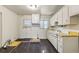 Kitchen with laminate flooring and white cabinetry at 162 Fairburn Sw Rd, Atlanta, GA 30331