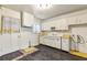 Kitchen with laminate flooring and white cabinetry at 162 Fairburn Sw Rd, Atlanta, GA 30331