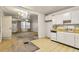 Functional eat-in kitchen with vintage cabinets and view into adjoining living room at 162 Fairburn Sw Rd, Atlanta, GA 30331