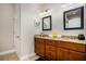 Bathroom with a double vanity, granite countertop, neutral paint, and tiled floors at 305 Deep Step Rd, Covington, GA 30014