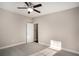 Bedroom featuring neutral walls, carpeted floors and a ceiling fan at 305 Deep Step Rd, Covington, GA 30014