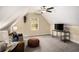 Bonus room featuring vaulted ceiling, a ceiling fan, and a leather sofa at 305 Deep Step Rd, Covington, GA 30014